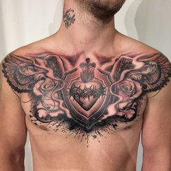 Татуировка мужчине на грудь