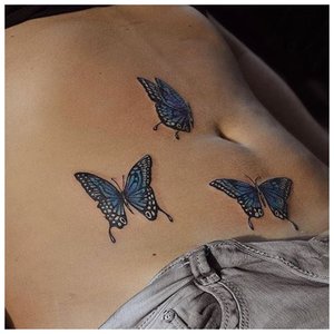 Бабочки на животе татуировка